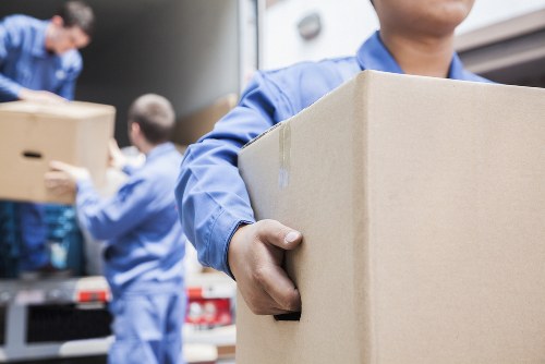 Ethical self storage staff reviewing modern slavery compliance documents