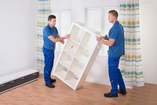 Local moving team handling boxes and household items in central London